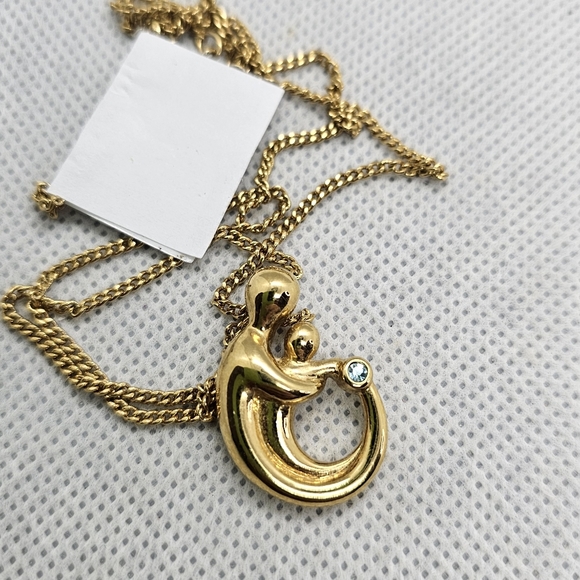 Goldtone Mother holding child with December Birthstone Fashion Necklace - Picture 2 of 4